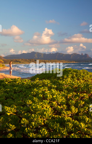 A visitor on Nukoli'i Beach, also known as Kitchens Beach, Kauai, Hawaii. (model released)