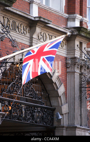 Union Flag, Union Jack, national flag of  United Kingdom flying on  flagpole outside St. James' Court, Victoria, London, England Stock Photo