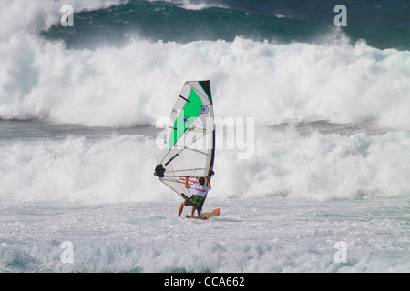 Windsurfers at Ho'okipa Beach, Maui, Hawaii. Stock Photo