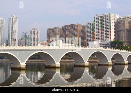 Arch bridge in asia downtown area, hong kong Stock Photo