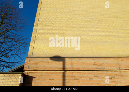 LAMP SHADOW ON BRICK WALL Stock Photo