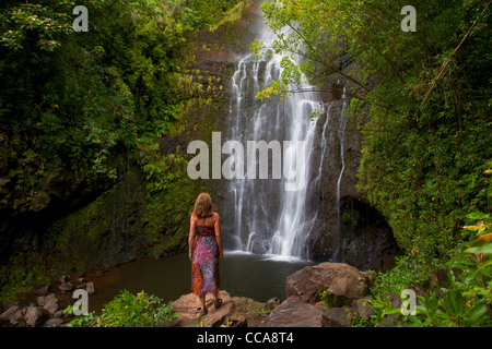 A visitor at Wailua Falls, near Hana, Maui, Hawaii. (model released) Stock Photo