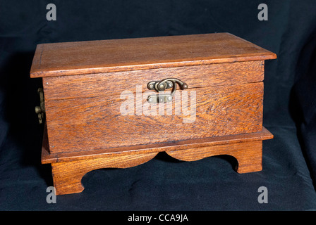 A wooden box with brass lock. Stock Photo