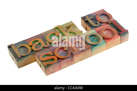 back to school words in vintage wooden letterpress type blocks, stained by color ink, isolated on white Stock Photo