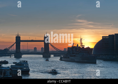 Tower bridge and HMS Belfast at dawn. London UK Stock Photo