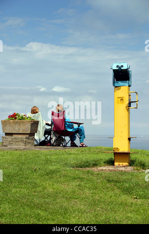 Coin operated binoculars and views out to sea from at Marine Parade Tankerton slopes in Whitstable Kent Stock Photo