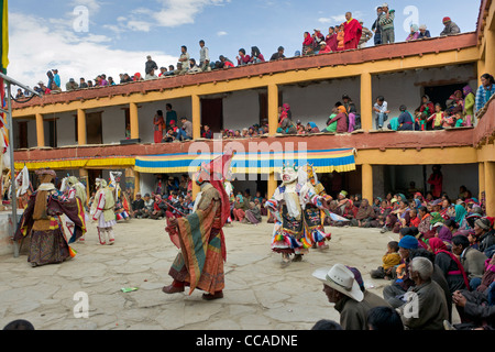 Masked Cham Dancers in the courtyard of Korzok Gompa during the Korzok Gustor, Lake Tsomoriri, (Ladakh) Jammu & Kashmir, India Stock Photo