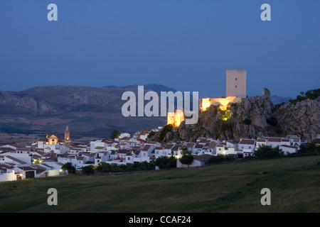 Small town of Canete la Real, Malaga province, Andalucia, Spain, at dusk with castle and church illuminated. Stock Photo