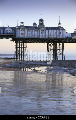 Eastbourne Pier dawn dusk sun rise set sunrise sunset sea seaside beach east Sussex England Stock Photo