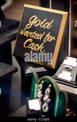 Sign in a Brighton Lanes jewellers which reads 'Gold wanted for Cash'. Brighton East Sussex England UK Stock Photo