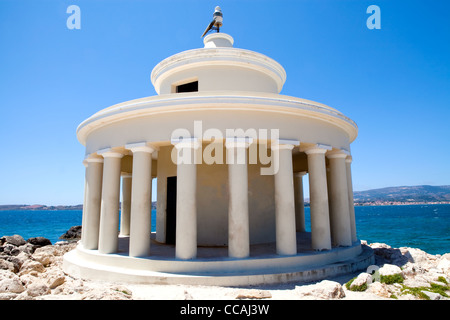 Lighthouse with blue sea in the background in Argostoli, Kefalonia, Greece Stock Photo