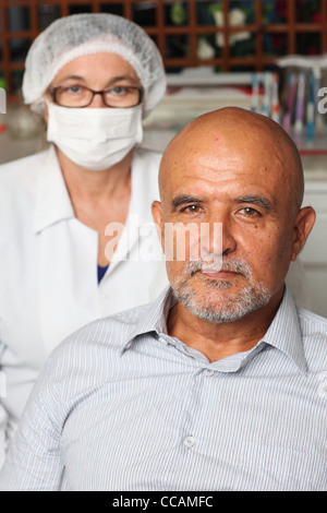 Middle aged man happy at the dentist Stock Photo