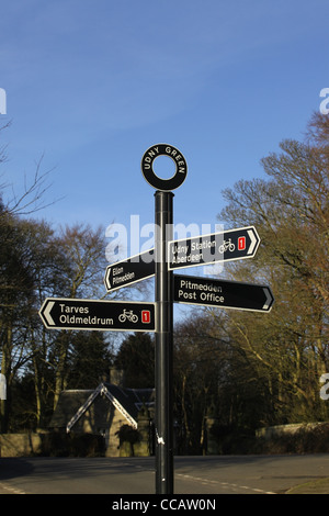 Road sign at the centre of the small village of Udny Green in Aberdeenshire, Scotland, UK Stock Photo