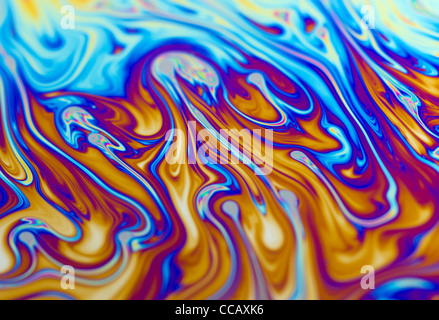 Macro close up of the surface of a colourful soap bubble with shallow focus. Stock Photo