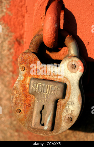old rusting padlock on farm buildings. Scotland UK