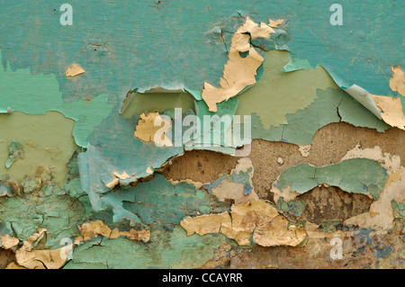 Background of neglected wall with layers of old paint Stock Photo