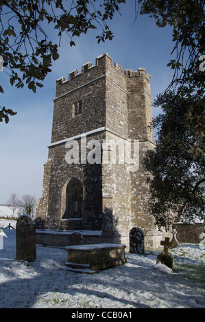 The tower of the historic 12th century church at Whitcombe, in the snow. The Dorset poet William Barnes was curate here from 1847 to 1852. England, UK Stock Photo