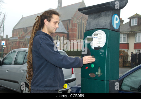 A car driver buys a ticket to park on Church Road Hove East Sussex. Picture by Pete Gawlik. Stock Photo