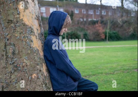 depressed, lonely young male boy Stock Photo