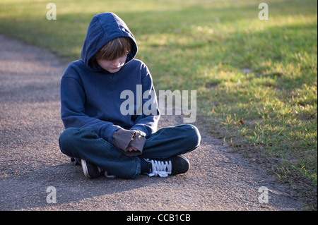 depressed, lonely young male boy Stock Photo