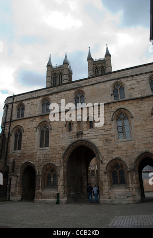 The Exchequer Gate in front of the towers of the West Front of Lincoln Cathedral Stock Photo