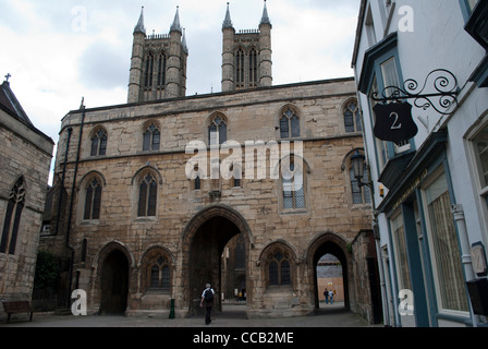 The Exchequer Gate in front of the towers of the West Front of Lincoln Cathedral Stock Photo