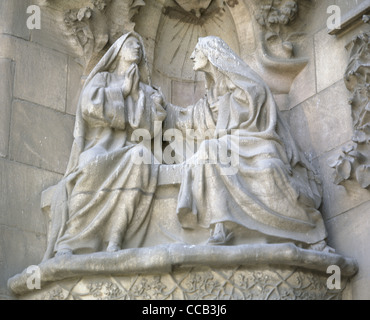 Basilica of the Holy Family. Nativity Facade. Portico of Faith. The Visitation by Lawrence Matamala (1856-1925). Barcelona. Stock Photo