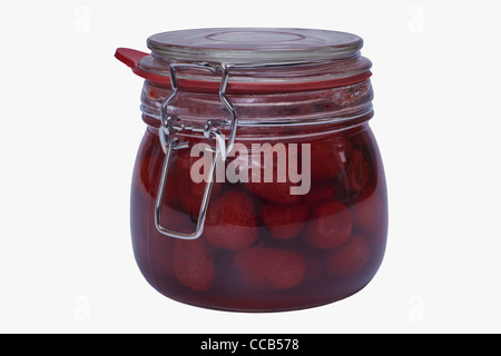 Ein Glas mit eingeweckten Erdbeeren | a jar with home canned strawberries Stock Photo