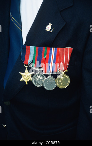 Four Canadian War Medals from WW-2 are hanging on a jacket of a Veterans Chest Stock Photo