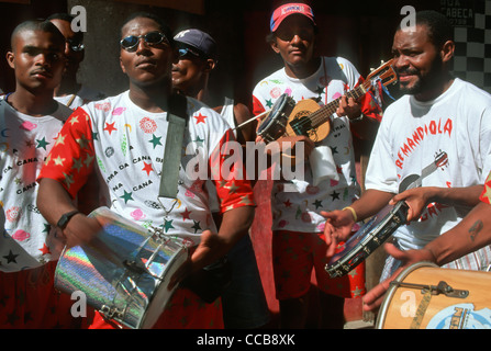 Salvador, Brazil. Group of musicians on the street during carnival with drums, pandeira, ukelele and tambourine. Stock Photo