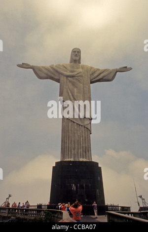 Christ the Redeemer statue of Jesus Christ rises above Rio de Janeiro Brazil atop Corcovado mountain Stock Photo