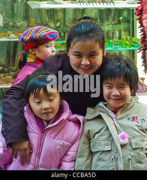 Paris, France, Portrait, Small Group People, Chinese Young Children, Watching Chinese new year Carnival in Street, immigrants minority family Stock Photo