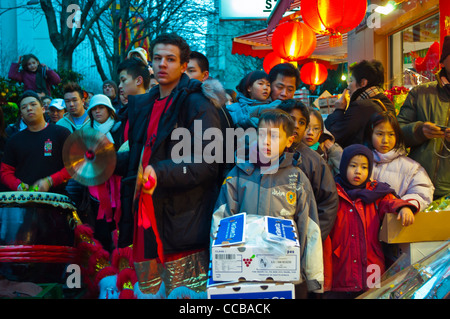 Paris, France, Crowd of Children, Families on Street Scene, Chinatown, Chinese New Years Audience Watching Dragon Dance, Paris integrated, street boys looking Stock Photo