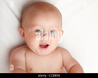 baby boy in diaper on white, blue eye Stock Photo