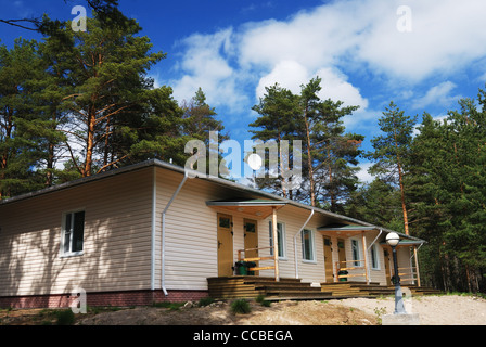 summer cozy cottage in northern pine wood Stock Photo