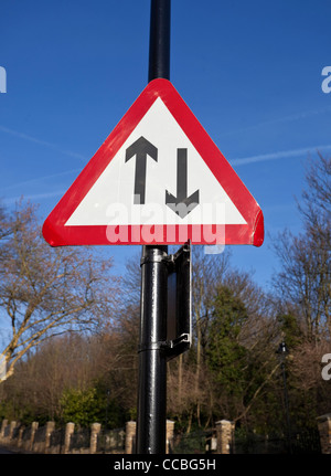 Two-way upright traffic sign, warning triangle, England, UK Stock Photo