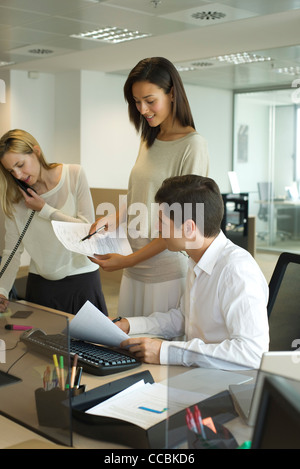 Colleagues collaborating in office Stock Photo