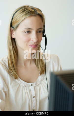 Professional woman wearing headset Stock Photo