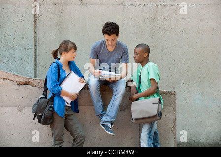 Friends discussing homework together Stock Photo