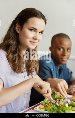 Young woman dining in restaurant Stock Photo