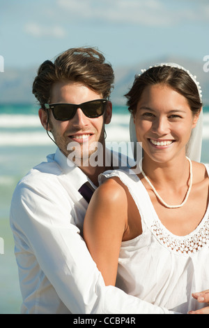Bride and groom at the beach, portrait Stock Photo