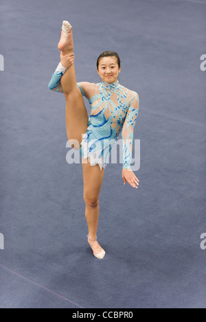 Female gymnast performing floor routine Stock Photo