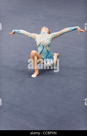 Female gymnast performing floor routine Stock Photo