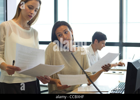 Colleagues working hard in office Stock Photo