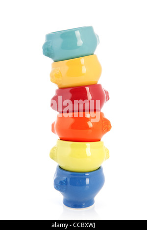 Stack of colorful soup cups isolated over white background Stock Photo