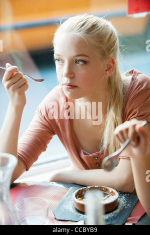 Young woman eating dessert Stock Photo