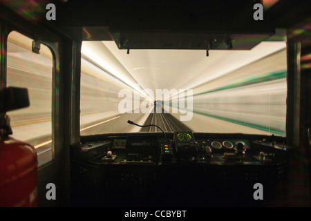 Train moving through tunnel, viewed through window Stock Photo