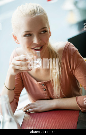 Young blond woman drinking water Stock Photo