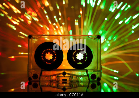 Cassette tape and multicolored yellow green lights on background Stock Photo