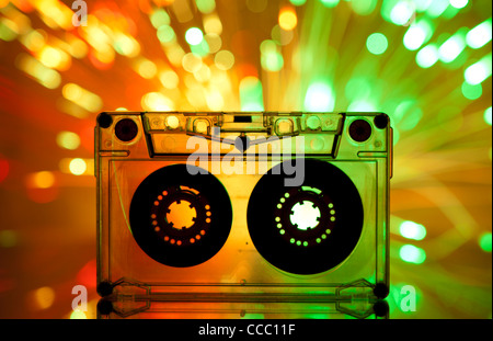 Cassette tape and multicolored yellow green lights on background Stock Photo